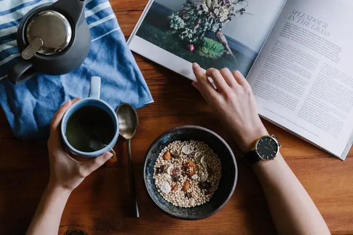 having a cup of black tea with cereal