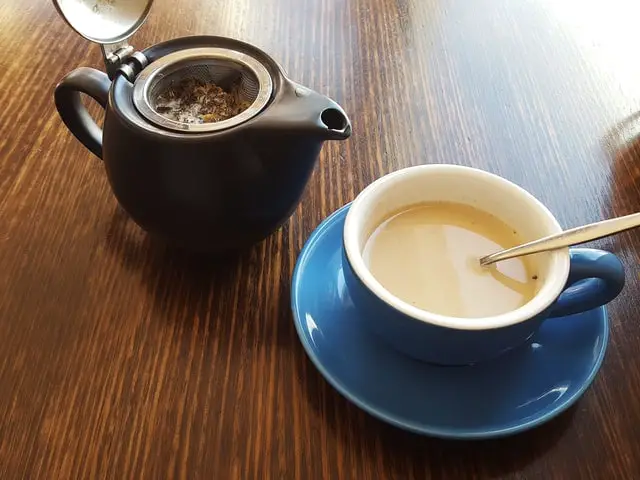 Milk Tea Poured To A Blue Ceramic Cup