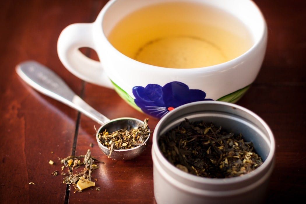 Green tea leaves and cup Green tea leaves and cup