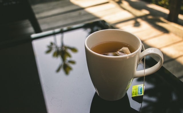 Dilmah tea bag in a white mug