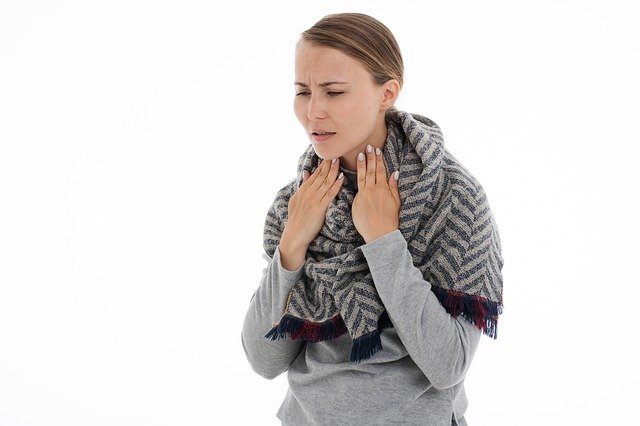 Woman Suffering With Throat Pain