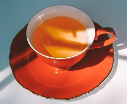 Red Ceramic Tea Cup and Saucer