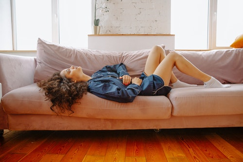 Woman Lying On Couch