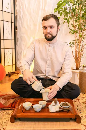 Young Man Getting Ready For Tea Time