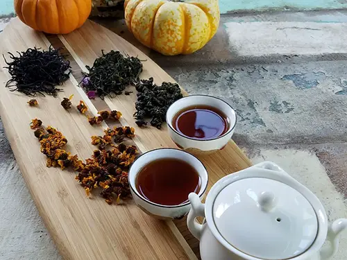 black tea leaves and cups