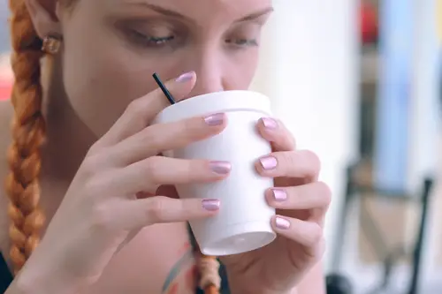 Girl sipping a cup of tea