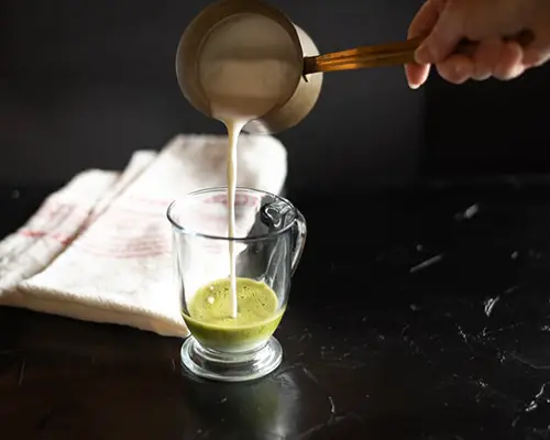 person making a matcha drink