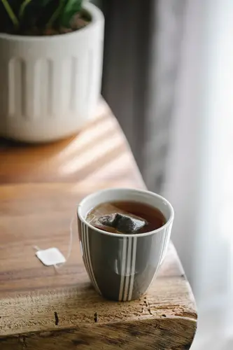 Hot teabag in stripes mug