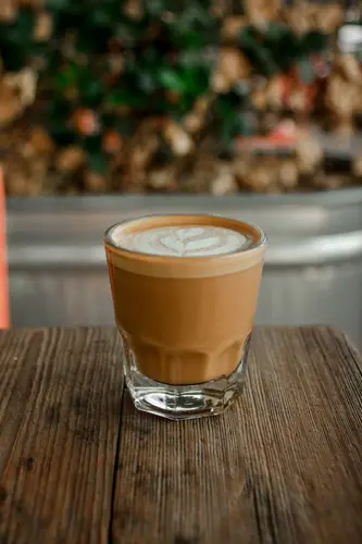 Tea Latte on top of wooden table top